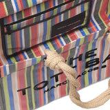 Close up of the red bag, showing texture of the PVC fabric