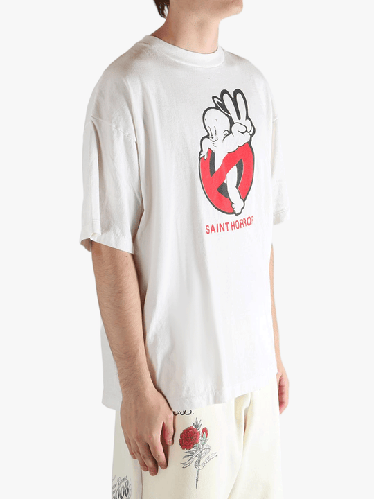 White t-shirt worn by a person, showing the shirt's fit