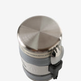 Close up of grey jar, showing texture of the stainless steel fabric