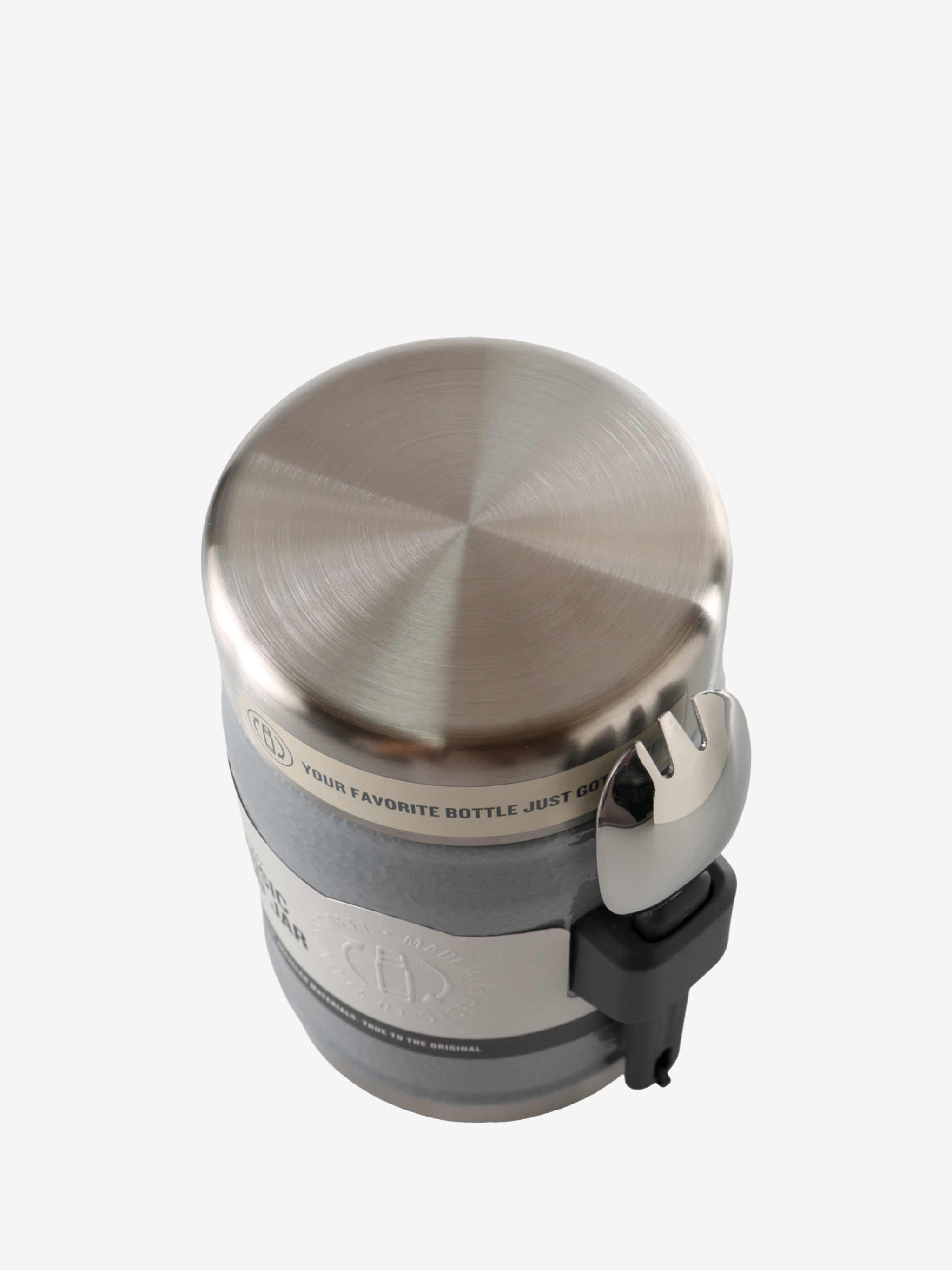 Close up of grey jar, showing texture of the stainless steel fabric