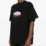 Black T-shirt  worn by a person, showing the  shirt's fit