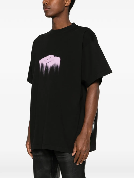 Black T-shirt  worn by a person, showing the  shirt's fit