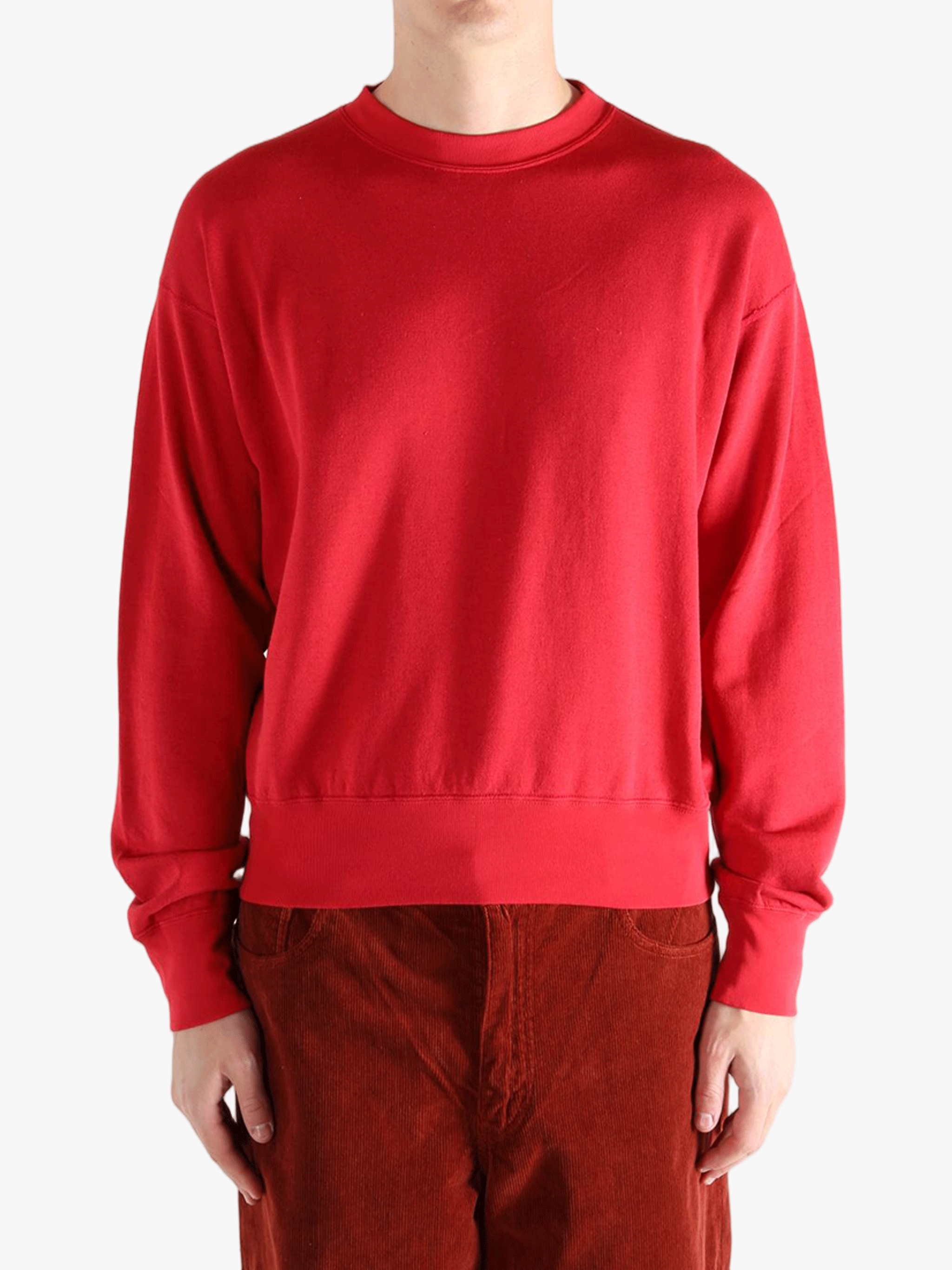 Red knitwear worn by a person, showing the knitwear's fit