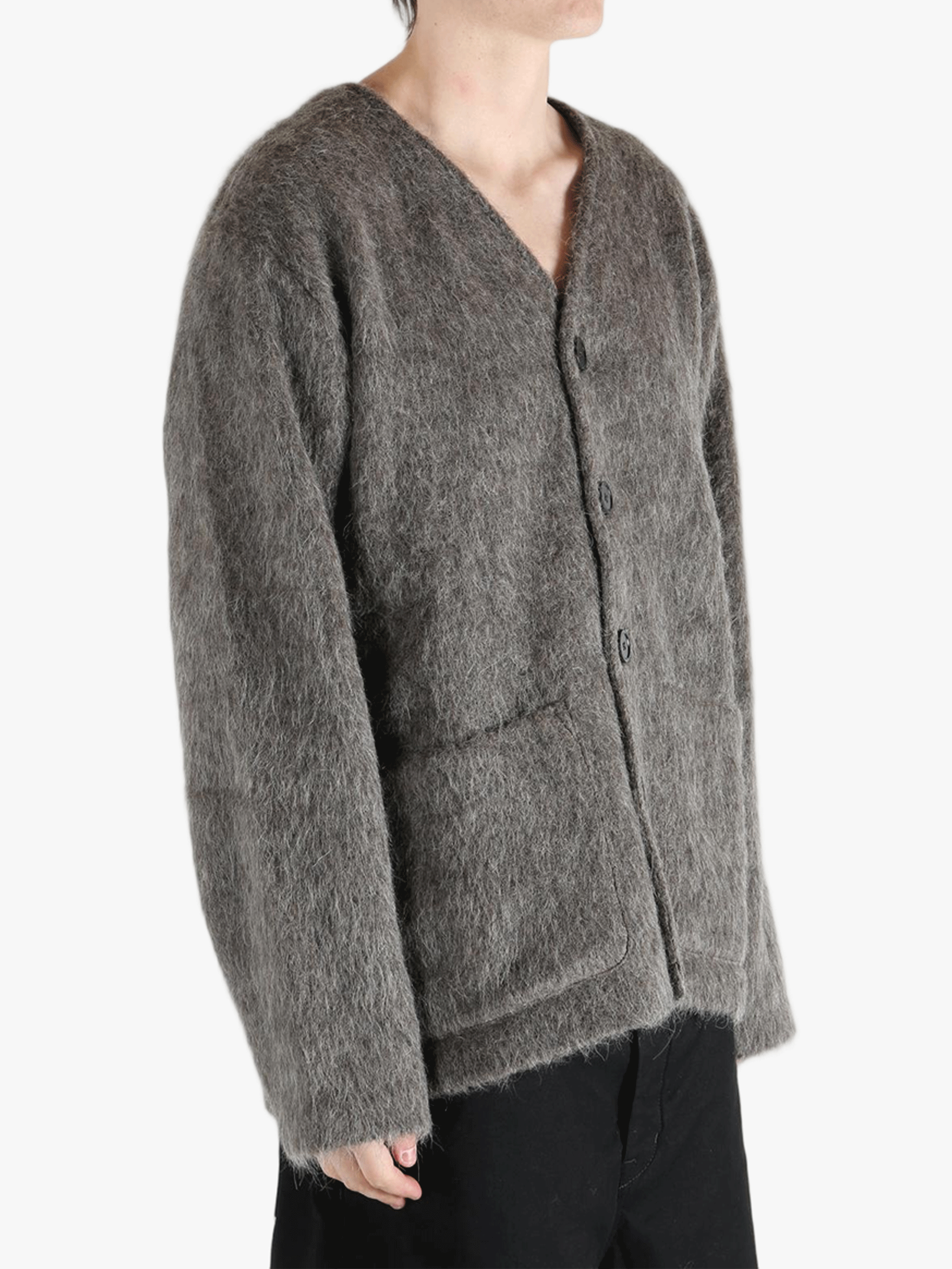 Grey cardigan worn by a person, showing the cardigan's fit