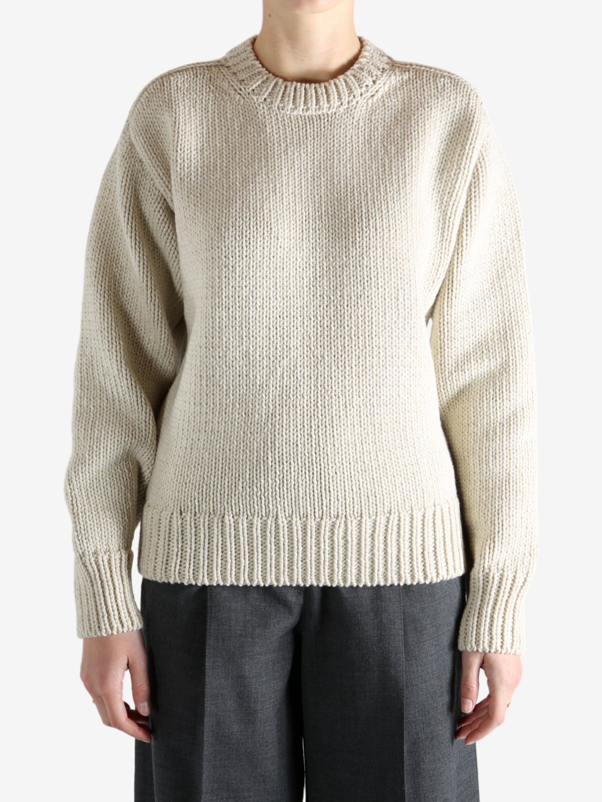 Tan sweater worn by a person, showing the sweater fit