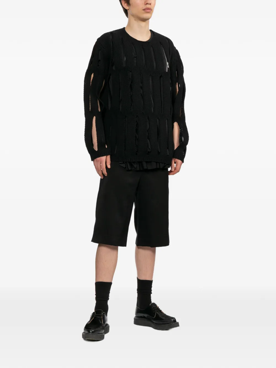 Black shorts worn by a person, showing the shorts's fit
