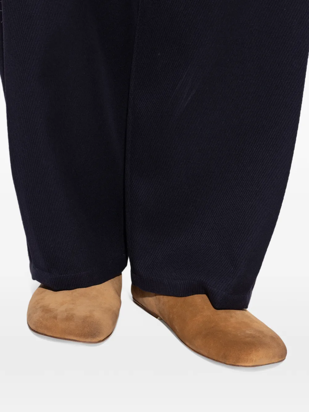 Brown shoes worn by a person, showing the shoes fit