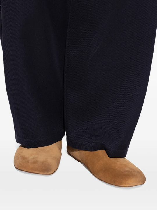 Brown shoes worn by a person, showing the shoes fit