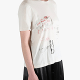 White shirt worn by a person, showing the shirt's fit