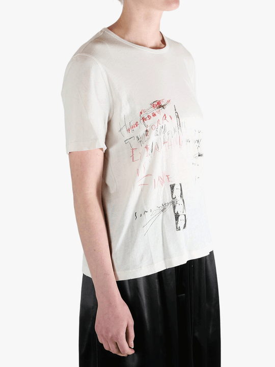 White shirt worn by a person, showing the shirt's fit