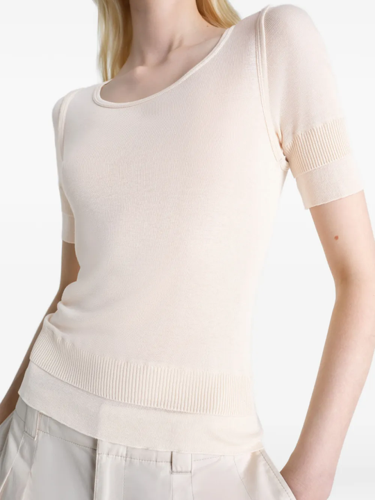 close up of white tops, showing texture of the viscose fabric
