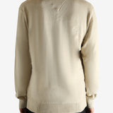 Tan shirt worn by a person, showing the shirt's fit