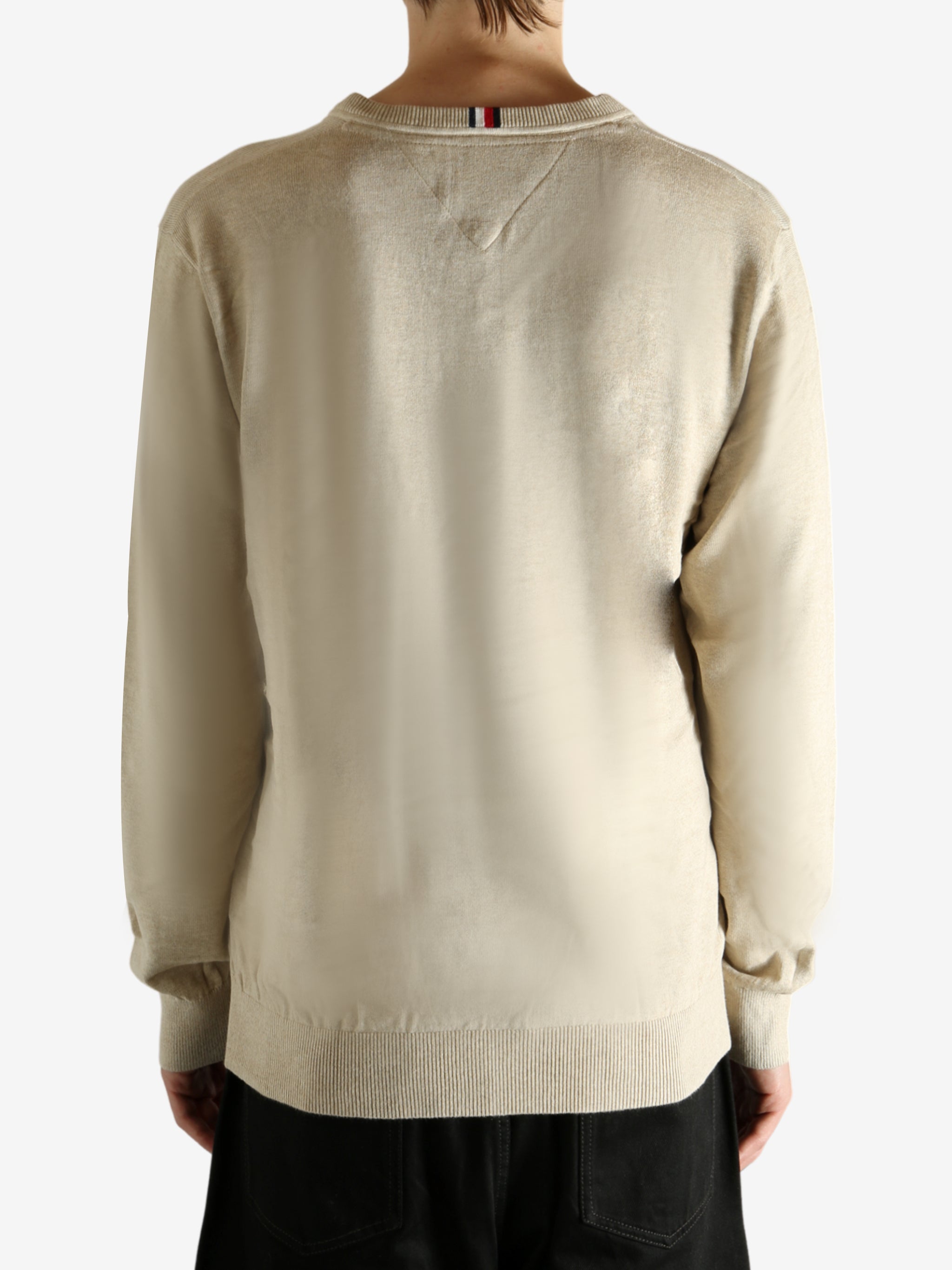 Tan shirt worn by a person, showing the shirt's fit