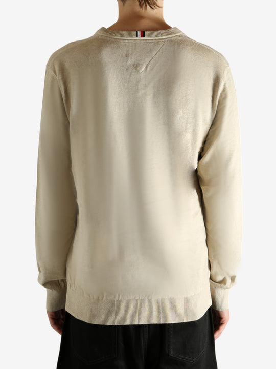 Tan shirt worn by a person, showing the shirt's fit