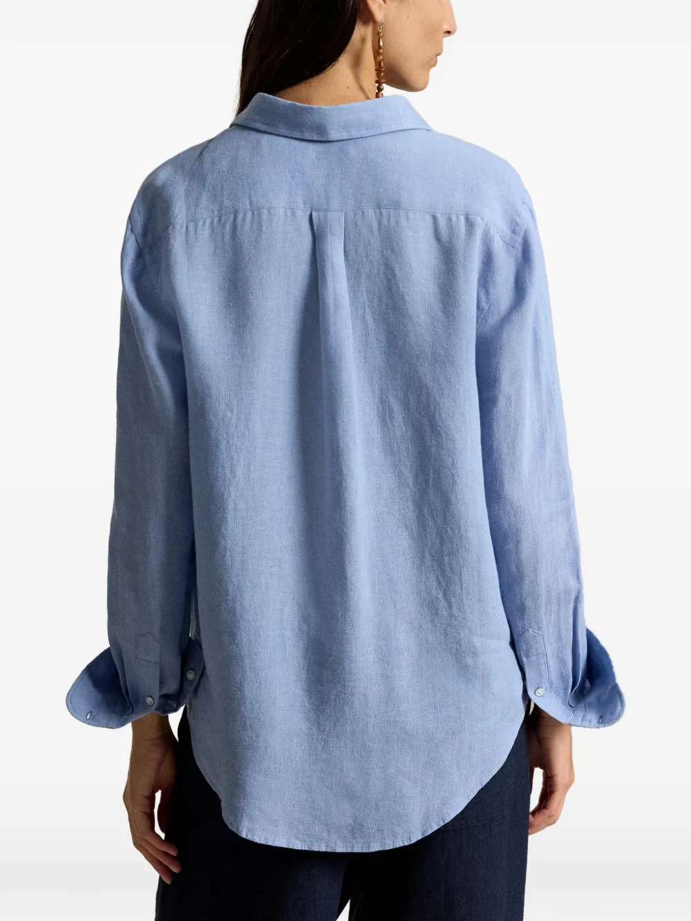 Blue shirt worn by a person, showing the shirt fit