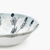 Close up of blue bowl, showing texture of the bone porcelain fabric