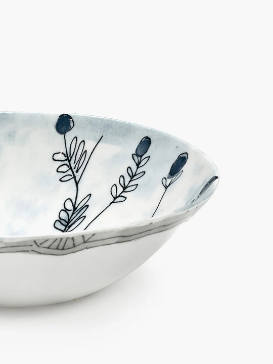 Close up of blue bowl, showing texture of the bone porcelain fabric