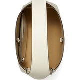 Close up of the white bag, showing texture of the leather fabric