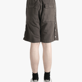 Brown shorts worn by a person, showing the shorts fit