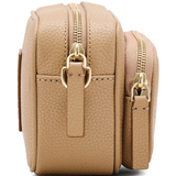 Close up of the brown bag, showing texture of the leather fabric