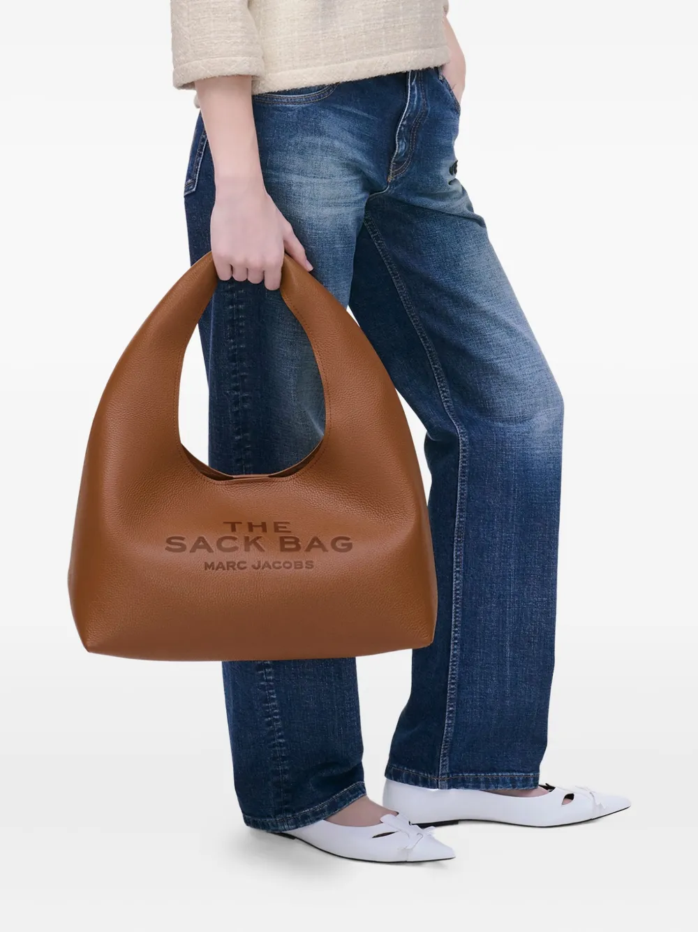 brown bags worn by a person, showing the bags fit