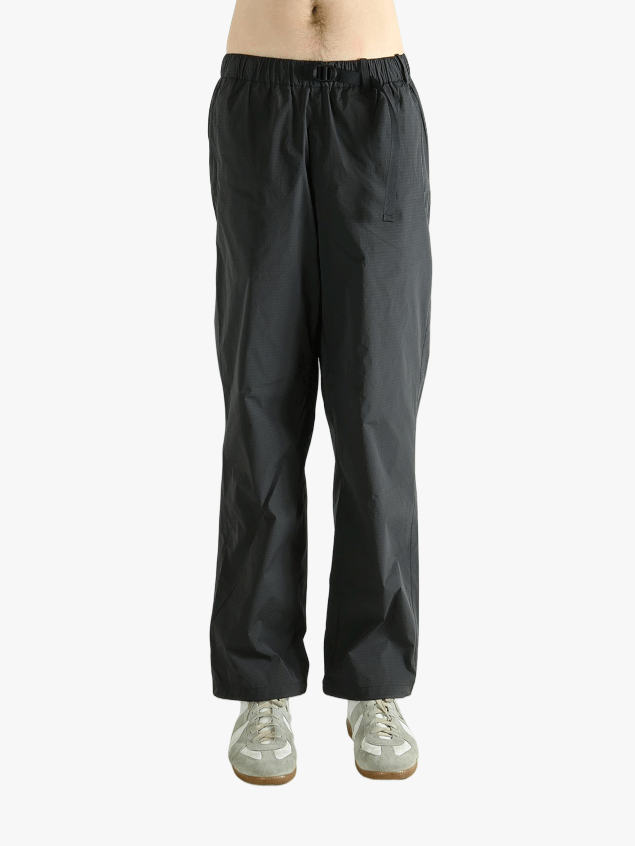 Grey pant worn by a person, showing the pant's fit