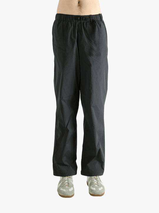 Grey pant worn by a person, showing the pant's fit