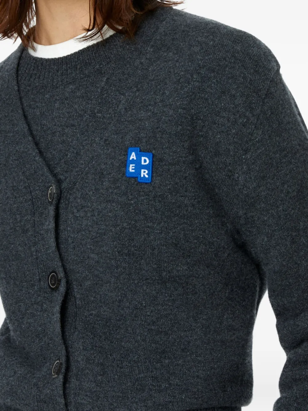 Close up of black jackets-coats, showing texture of the wool fabric