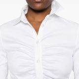 Close up of white shirt, showing texture of the cotton fabric