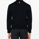 Blue knitwear worn by a person, showing the knitwear's fit