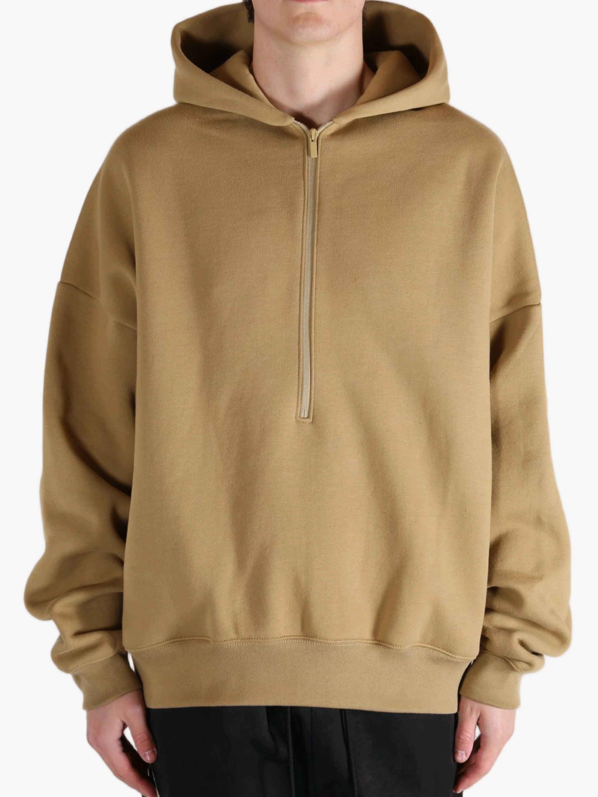 Brown hoodie worn by a person, showing the hoodie's fit