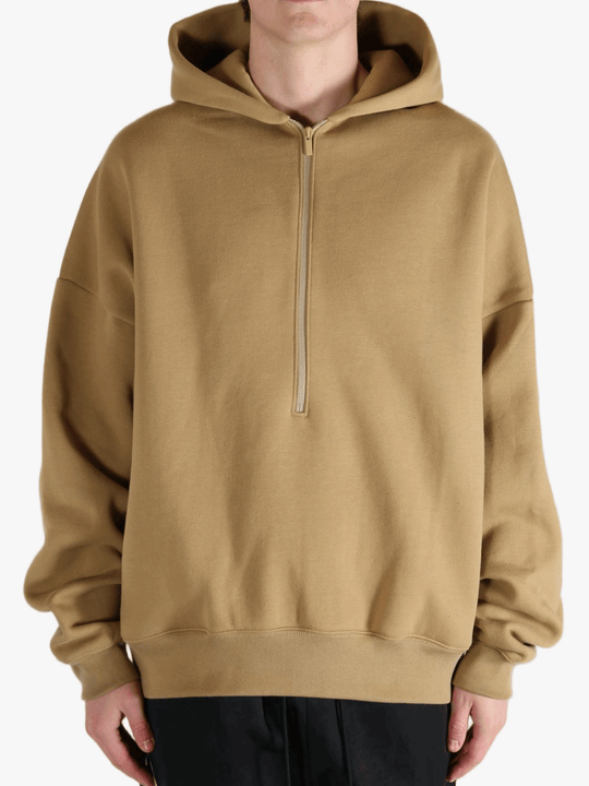 Brown hoodie worn by a person, showing the hoodie's fit