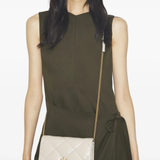 Tan wallet worn by a person, showing the wallet fit