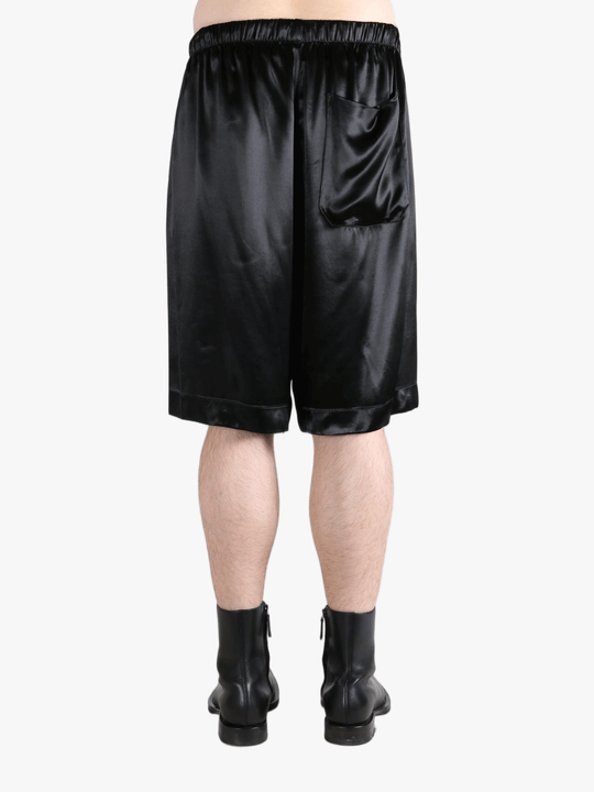 Black short worn by a person, showing the short fit