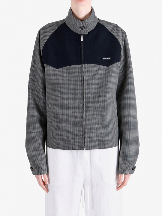 Grey jacket worn by a person, showing the jacket fit
