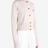 Tan knitwear worn by a person, showing the knitwear fit