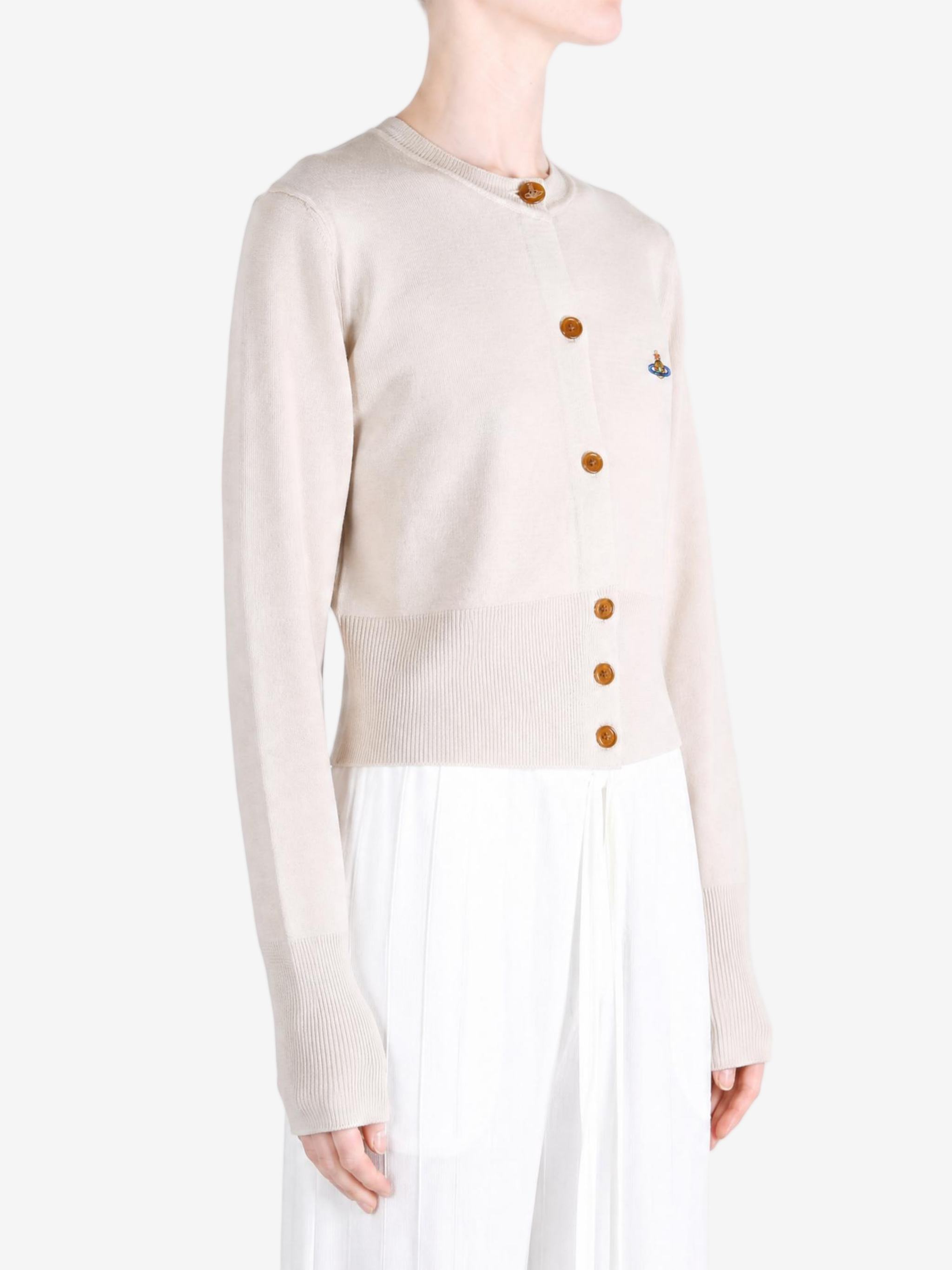 Tan knitwear worn by a person, showing the knitwear fit