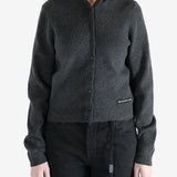 Grey cardigan worn by a person, showing the cardigan fit