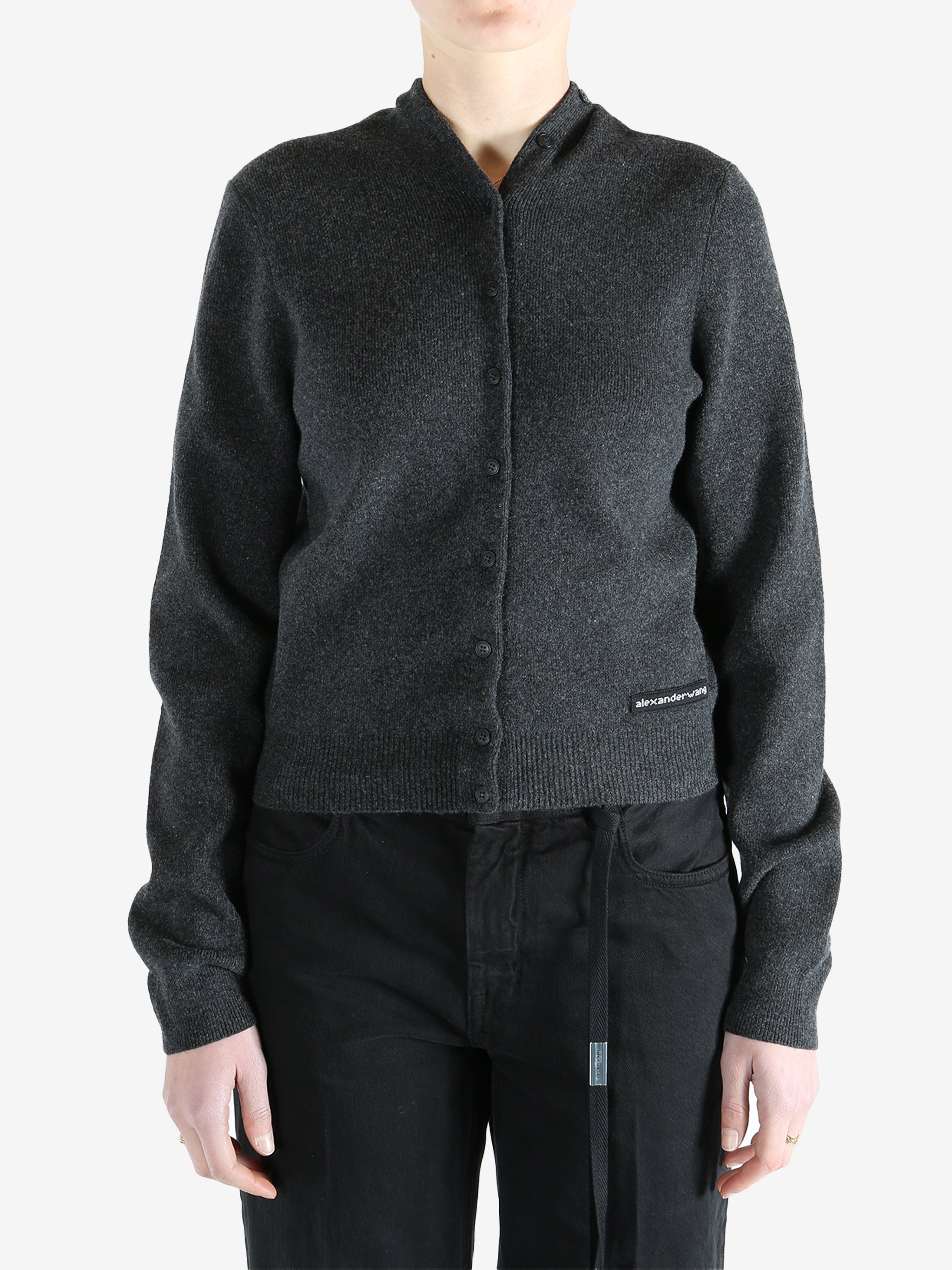 Grey cardigan worn by a person, showing the cardigan fit