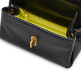 close up of black bags, showing texture of the leather fabric