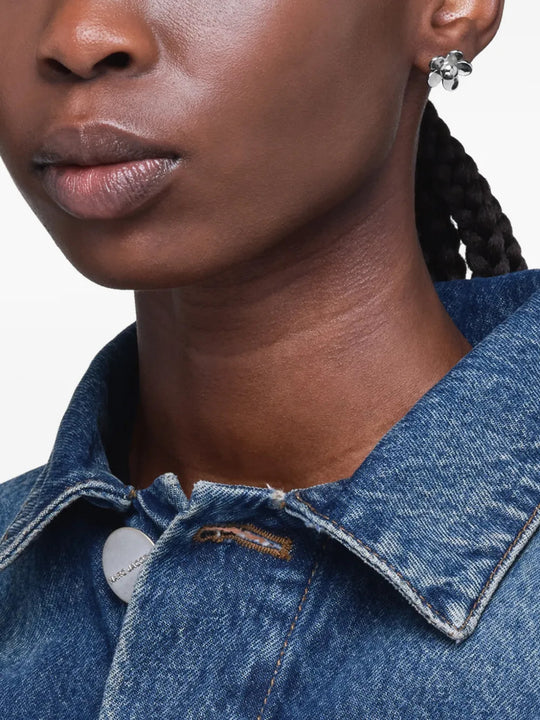 Blue jewelry worn by a person, showing the jewelry fit