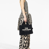 black bag worn by a person, showing the bag fit