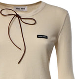 Close up of Tan t-shirt, showing texture of the leather fabric