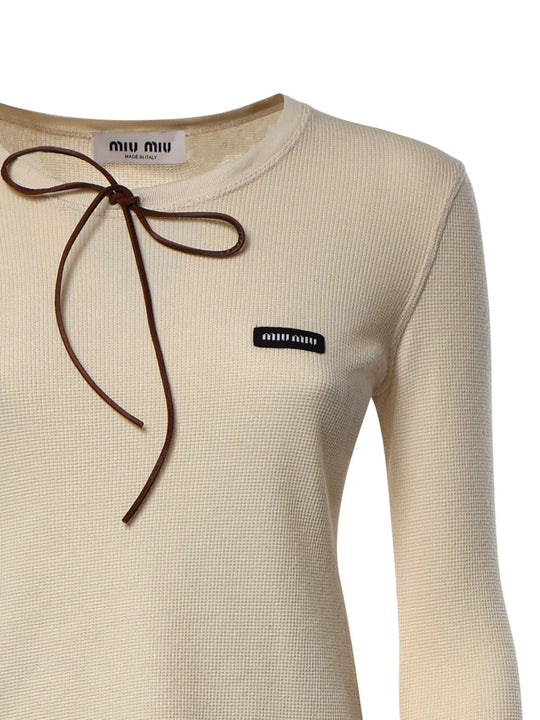 Close up of Tan t-shirt, showing texture of the leather fabric