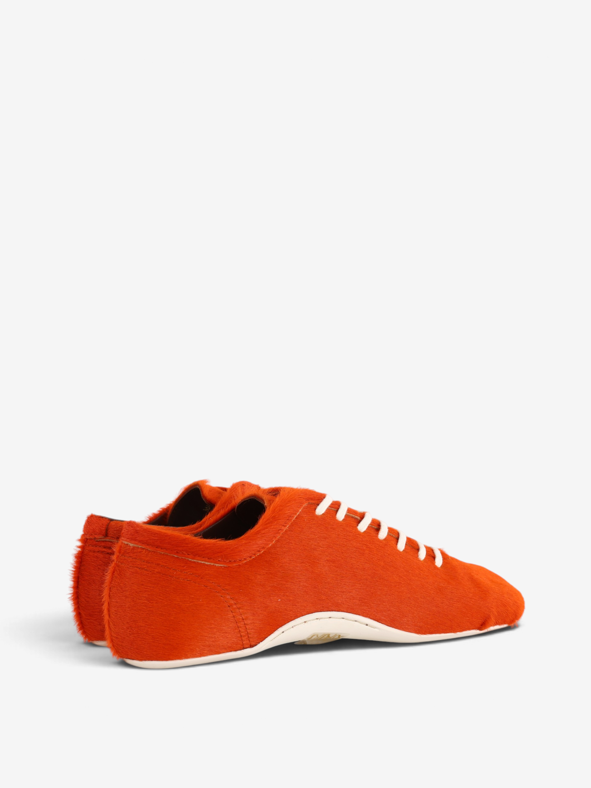 Orange shoes, side view