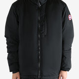 Black jacket worn by a person, showing the coat's fit