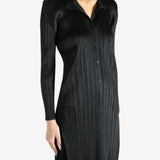 Black shirt worn by a person, showing the shirt's fit