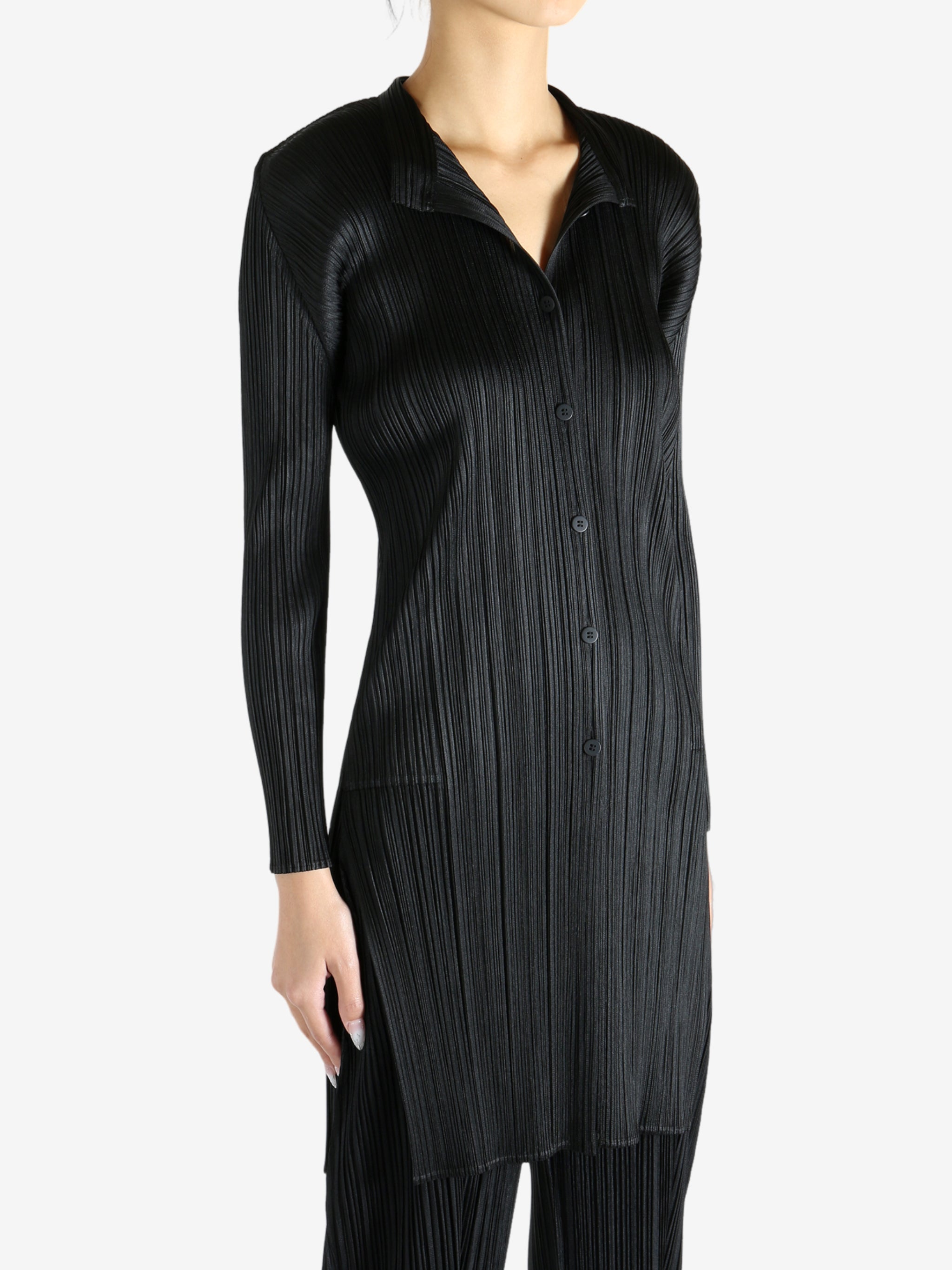 Black shirt worn by a person, showing the shirt's fit