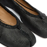 Close up of black flat , showing texture of the lamb skin fabric