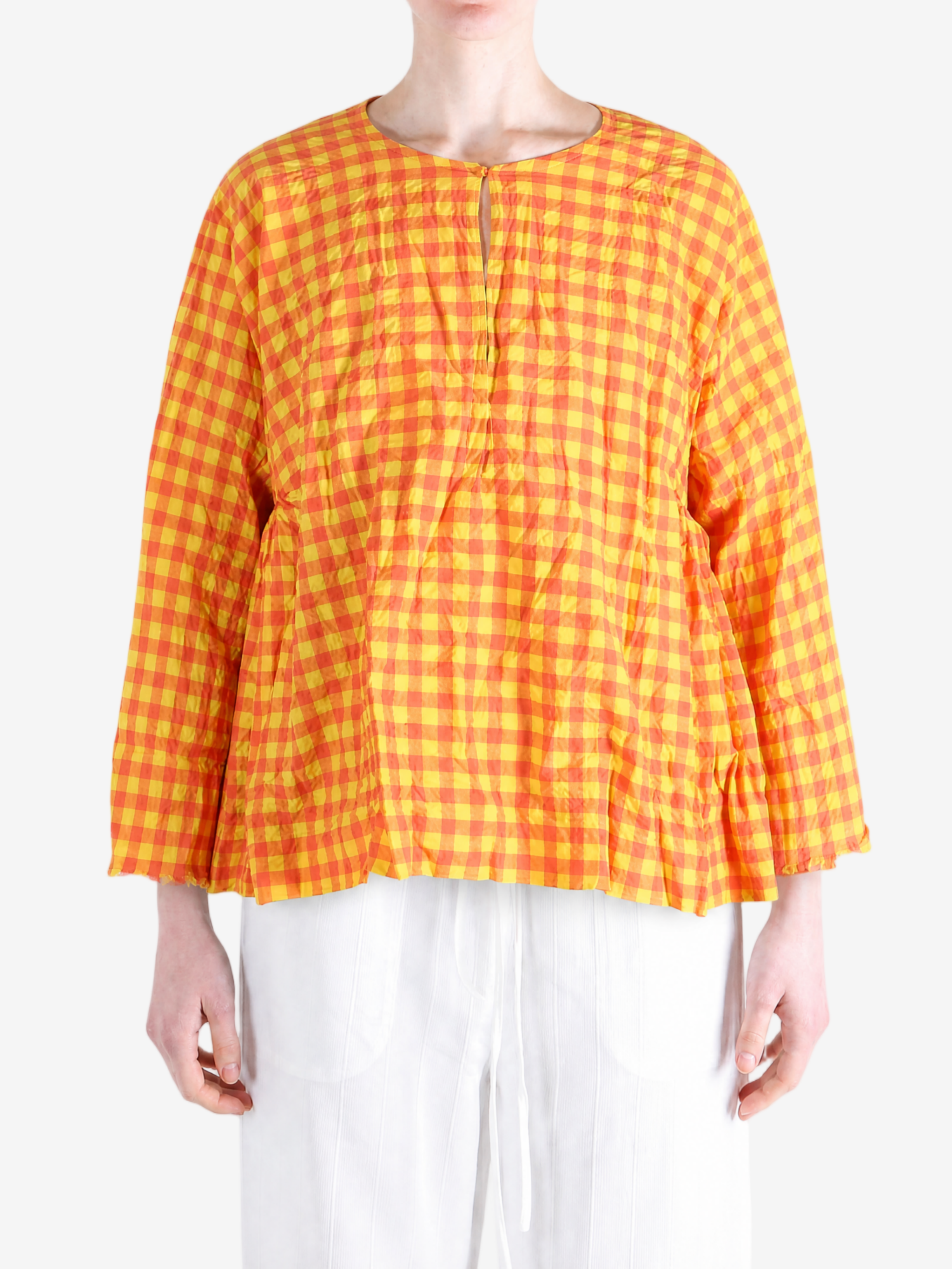Orange shirt worn by a person, showing the shirt fit